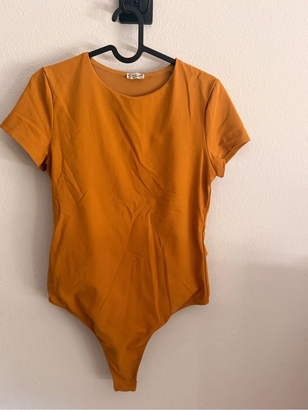 Free People Alexis Tee Bodysuit in a mustard